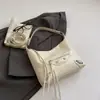 Bolso de axila de gran capacidad estilo coreano para mujer, bolso de trabajo, nuevo modelo primavera 2026, bolso tipo cubo biker con tachuelas, bolso cruzado