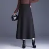 Falda versátil de color liso para mujer, nueva moda otoño e invierno 2026, de cintura alta, adelgazante, que cubre las caderas, larga, línea A, moderna