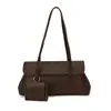 Bolso de axila de alta gama, nicho y sutilmente lujoso para mujer, con un nuevo diseño minimalista con patrón de lichi texturizado, estilo tote y correa para el hombro, perfecto para el día a día.