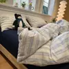 Juego de cuatro piezas a rayas de algodón lavado estilo nórdico minimalista, sábana bajera, sábana encimera, funda de edredón juego de tres piezas para ropa de cama de dormitorio de estudiante