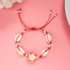 Directo de fábrica moda pequeña fresca flor de arcilla blanda concha pulsera tejida femenina joker cuerda de mano tejida a mano venta al por mayor