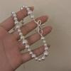 Collar de perlas grises con lazo degradado, cadena de clavícula ligera de lujo de alta gama, accesorios de vestir atmosféricos para damas de celebridades cibernéticas