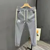 Nuevos pantalones casuales de otoño para hombre, modernos y versátiles, pantalones deportivos tipo jogger de corte ajustado con elegante diseño de patchwork