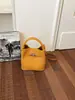 Bolso de mano tipo cesta de verduras transfronteriza para mujer 2026 nuevo bolso versátil de mano nicho para el trabajo diario bolso cruzado elegante bolso tipo cubo