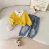 Conjunto de Top com Patchwork de Lapela Texturizada de Primavera 2026 + Calça Jeans Bordada com Laço