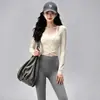 Conjunto deportivo de yoga de secado rápido para mujer, con un top de manga larga protector del sol y pantalones deportivos elásticos y transpirables, un atuendo versátil para el día a día