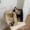 Bolso Tote de Lona de Moda de Gran Capacidad para Viajes Diarios 2026 Nuevo Otoño para Mujer Bolso de Hombro Único, de Mano, Cruzado de Gama Alta de Nicho