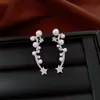 Pendientes de borla con flor de trébol de circonita vintage con un toque de alta gama, pendientes versátiles y de moda al por mayor