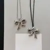 Sombra suave y delicada, collar con lazo de cordón de cuero, estilo fresco y minimalista, cadena para suéter, sensación de lujo ligero y alta gama, venta al por mayor de collares
