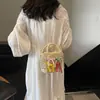 La popular bolsa tejida a mano de este año para mujer 2025 verano nuevo bolso de mano nicho bandolera cubo de paja