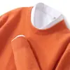 Otoño/Invierno 2026 Nuevo Suéter de Punto sin Costuras de Lana Pura para Hombre, Cuello Redondo, Línea Principal, Suéter Base Holgado