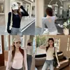 Top moderno y versátil con un elegante diseño en el hombro, espalda cruzada, efecto adelgazante, cintura ajustada, camiseta de manga larga 26002