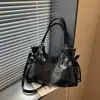 Bolso grande de moda retro para mujer 2026 nuevo bolso casual simple para el antebrazo bolso tote de hombro texturizado para el trabajo