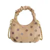 Bolso nuevo de lunares de nicho para mujer, bolso de mano pequeño y fresco con pliegues de moda, bolso de hombro y bandolera de moda en forma de media luna