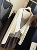 Elegante top de punto a rayas de dos piezas falsas retorcidas para mujer, nuevo estilo coreano de otoño, ajuste ceñido, manga larga, blusa única