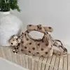 Bolso de mano de lunares de nicho estilo coreano transfronterizo para mujer, nuevo 2026 súper popular, bolso versátil de moda para hombro y cruzado