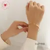 Pulsera Zhenxi Estilo Ins No se decolora Trenzado de línea Diseño abierto Acero de titanio Joyería de oro de 18 quilates Estilo geométrico minimalista