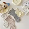 Calcetines de lunares grises para mujer Primavera y Otoño ins de moda algodón rizado estilo japonés personalizados de lunares de longitud media para la pantorrilla verano finos