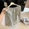 Camisa a rayas de manga larga vintage estilo francés para mujer, nuevo modelo de otoño 2026, corte holgado, elegante y con estilo para ir al trabajo