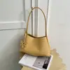 Bolsa Feminina de Axila 2026 Nova Estilosa de Verão Pequena de Nicho Toque de Luxo Textura Trançada Bolsa de Ombro Único Bolsa para Deslocamento de Mão