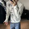 Camiseta unisex de manga larga con cuello redondo y estampado moteado estilo punk americano, hombros normales, corte ajustado como capa base, atuendo de pareja, top versátil
