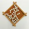 Perla de imitación de agujero medio de aguja única para resaltar el abdomen con accesorios de diamante colgante de perla suelta blanca hecho a mano para bricolaje al por mayor