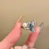 Anel Flor de Pérola Borboleta Feminino Primavera 2025 Novo Anel de Dedo Explosivo Luxo Leve Nicho Alto Padrão Anel de Dedo Empilhável