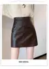 Saia Petite Feminina 2026 Outono/Inverno Novo Estilo Popular Este Ano Cintura Alta Emagrecedora Elegante Couro PU Colada ao Corpo Curta