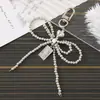 Nuevo Colgante Creativo de Cadena Colgante con Lazo de Perlas para Bolso, Funda de Teléfono, Llavero, Adorno, Exquisito Accesorio de Regalo Pequeño