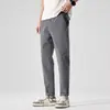 Pantalones casuales de algodón puro para hombre, primavera y verano, nuevos pantalones cortos rectos ajustados, elásticos, casuales, combinables, color blanco arroz para hombre.