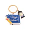 Llaveros personalizados más vendidos transfronterizos, dijes para mochilas, colgantes de aleación para la temporada de graduación, accesorios con temática de campus para las mochilas de los estudiantes
