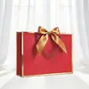 Empaque Lazo de Regalo Personalizado Bolsa de Papel de Mano Bolsa de Compras Lista para Usar Exportación Transfronteriza Impresión de Logotipo Fabricante Envío Gratis