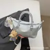 2026 Nova Bolsa Boston Estilo Doce Feminina Bolsa de Mão de Alto Valor para o Trabalho Ombro Único Transversal Versátil Bolsa Almofada