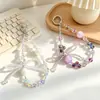 Nuevo accesorio de cadena para teléfono con lazo de cuentas de cristal de celebridad de internet, sección corta, colgante para teléfono, colgante anti-pérdida para teléfono, colgante para bolso