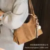Bolso de gamuza para mujer, gran capacidad, nuevo 2025, vintage, versátil, de hombro, para llevar debajo del brazo, bolso tote para estudiantes universitarias, para clases
