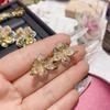 Pendientes de lujo calientes para transmisión en vivo Camelia chapados en oro de 18 quilates, totalmente de diamantes, con temperamento rico, aretes de tesoro de orquídea mariposa de colores para mujer