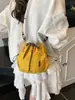 Bolso bandolera de hombro único de estilo coreano para comercio exterior, bolso de cubo fresco con cordón para mujer, bolso de hombro pequeño casual de nailon texturizado transfronterizo