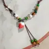 Collar con colgante de campana de mariposa de cerámica de estilo étnico retro para mujer, diseño nuevo y moderno, cadena larga para suéter, accesorios