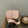 Outono de 2026 Nova Bolsa Feminina Estilo Coreano para o Trabalho Retrô Bolsa Transversal Pequena Quadrada Feminina Personalidade Moda Simples Bolsa de Ombro
