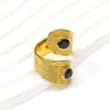 Europa e Estados Unidos cruzados retro luxo anel de gema de cabeça dupla feminino nicho high-end 18K ouro titânio aço joia de mão atacado