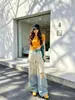 Conjunto Esportivo Casual Estilo Preguiçoso para Mulheres Verão Top Soltinho de Manga Curta Listrado Calça Longa de Pernas Largas Conjunto de Duas Peças