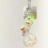 Estilo Ins Carrillón de Viento de Botella Flotante Llavero de Teléfono Colgante Pequeño Medusa Estrella Correa para Bolso Decoración Versátil para Mujeres