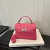 Otoño 2026 Nuevo Bolso Kelly Bolso de Mano Fresco de Gama Alta Bolso Cruzado para Mujer Sentido de Gama Alta Bolso de Diseño de Nicho bolsos