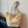 Bolsa de mano tipo tote simple de estilo coreano al por mayor para mujer 2025 Verano Nuevo Gran Capacidad Hombro Único Lona Versátil Bolso de Axila