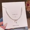 Colar com Pingente de Laço de Pérola e Zircônia para Mulheres Elegante de Alto Padrão Corrente Clavicular Acessório da Moda Versátil