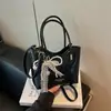Bolso Tejido de Nicho de Alta Gama Nuevo de Verano Transfronterizo, Bolso Cubo, Bolso de Hombro de Alta Gama Simple y Moderno