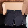 Versátiles shorts casuales de verano de estilo americano de longitud de cuarto, modernos shorts de trabajo finos de tres cuartos, shorts ajustados que realzan la altura