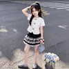 2026 Top Floral de Manga Curta Verão Novo Estilo Moda Meninas Renda na Barra Bolo Bufante Saia Curta Conjunto de Duas Peças