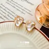 Pendientes de camelia de aguja de plata elegantes y delicados con diamantes, estilo francés, sensación de alta gama, lujo ligero, pendientes de moda y versátiles