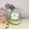 Bolso de mano de princesa de celebridades de Internet de estilo coreano para niña pequeña, monedero de color en contraste, minibolso de hombro con accesorios de ropa para bebé.